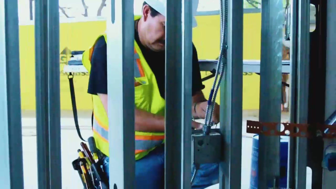 Wired Generations electrician installing electrical wiring at a commercial job site